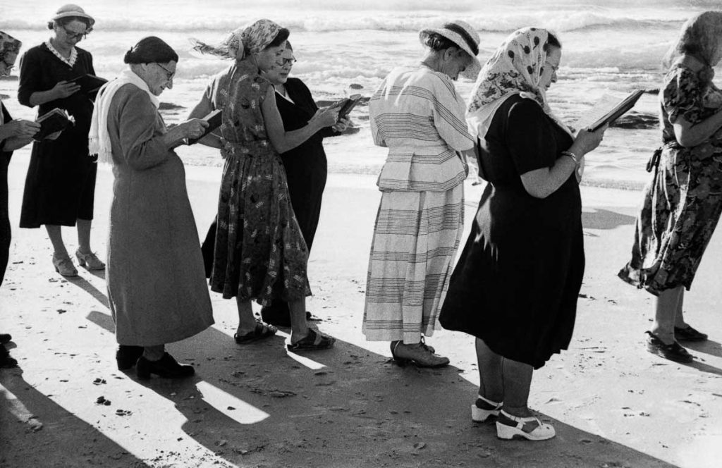 On the first day of Rosh Hashanah, the Jewish New Year, participants offer a prayer by throwing sins away into the sea. Tel Aviv, 1954.