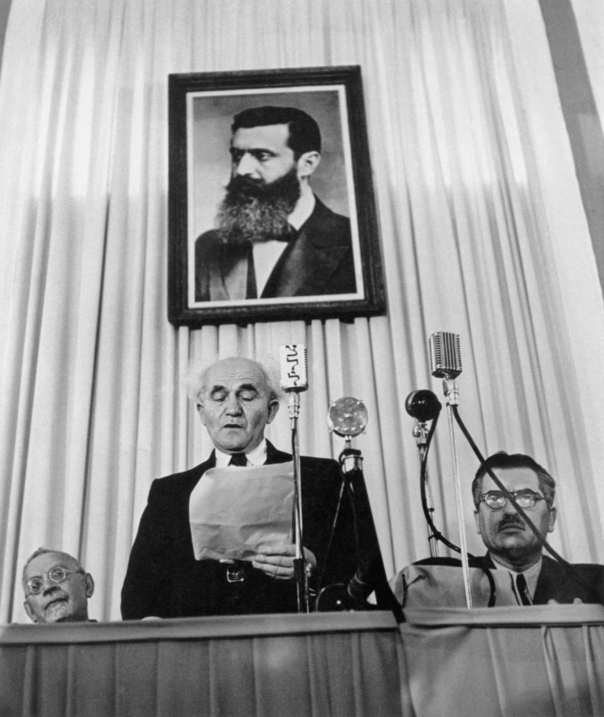 Founder of the state of Israel David Ben-Gurion reads the proclamation that will establish Israel as an independent nation. Tel-Aviv, May 14th, 1948.