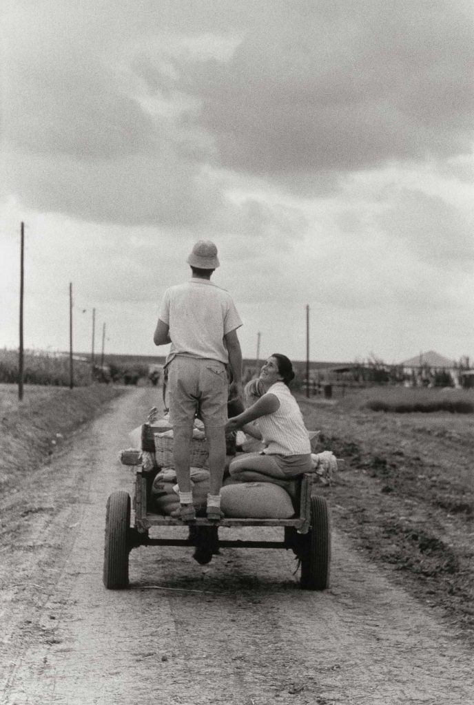 A farmer with his family on a tractor in a kibbutz near Ashkelon. 1958.