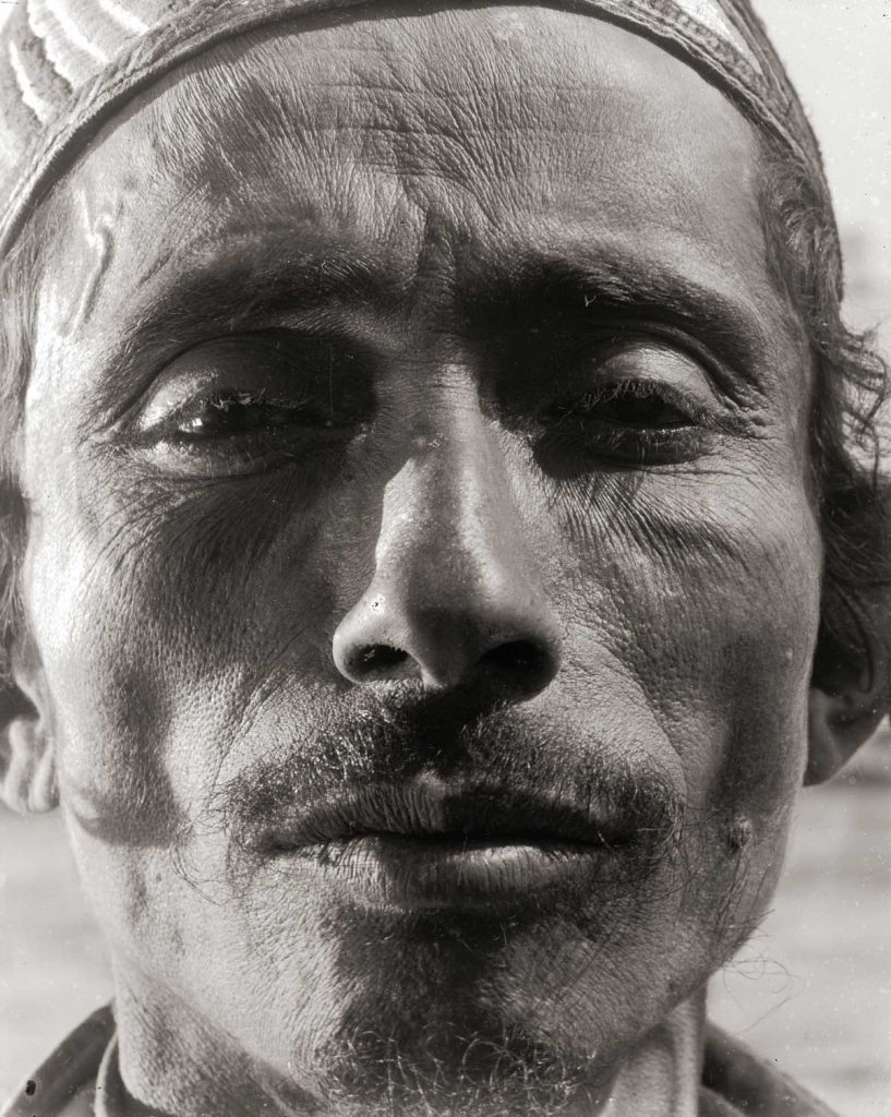 Portrait of a man with a moustache and cap. Mandatory Palestine, 1931-1935.